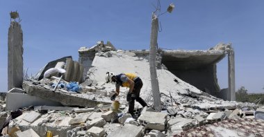 A civil defense worker inspects a damage house after shelling hit the town of Ibleen, a village in southern Idlib province, Syria, July 3, 2021. (AP File Photo)