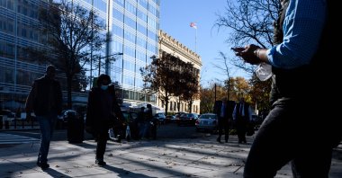 People walk on the streets in downtown Washington, D.C., U.S., Nov. 18, 2021. (AFP Photo)
