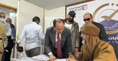Seif al-Islam Gadhafi (R), son and one-time heir apparent of late Libyan dictator Moammar Gadhafi, registers his candidacy for the country’s presidential elections, Sabha, Libya, Nov. 14, 2021. (AP Photo)