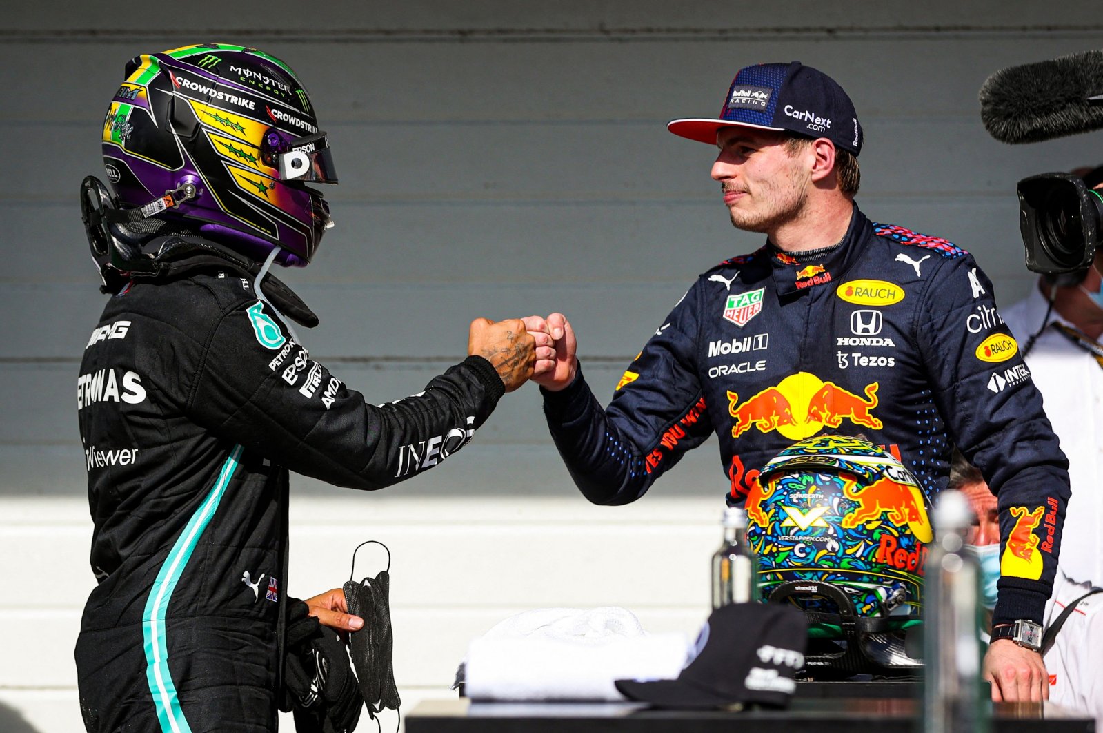 Mercedes&#039; Lewis Hamilton (L) and Red Bull&#039;s Max Verstappen (R) greet each other after obtaining the first and second positions in Sao Paulo Grand Prix, Sao Paulo, Brazil, Nov. 14, 2021. (AFP Photo)