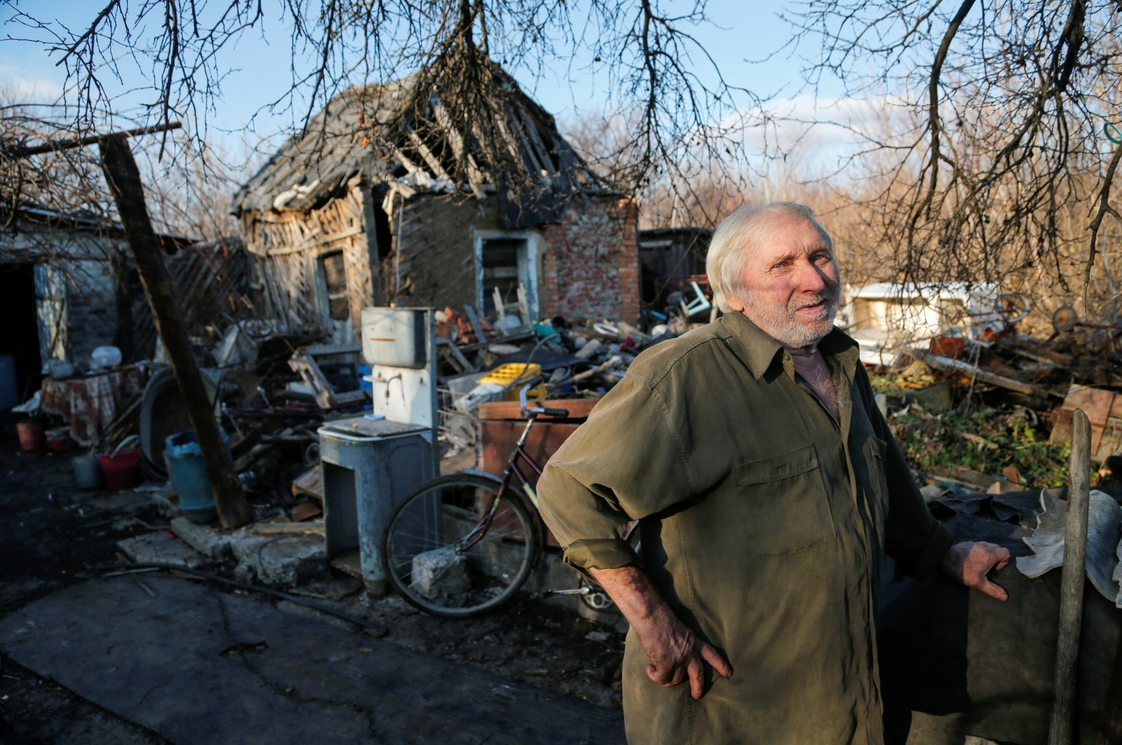 Local resident Victor Luksha, 68, stands next to his family&#039;s property damaged by shelling, in the rebel-controlled town of Horlivka (Gorlovka) near Donetsk, Ukraine, Nov. 24, 2021. (REUTERS/Alexander Ermochenko Photo)