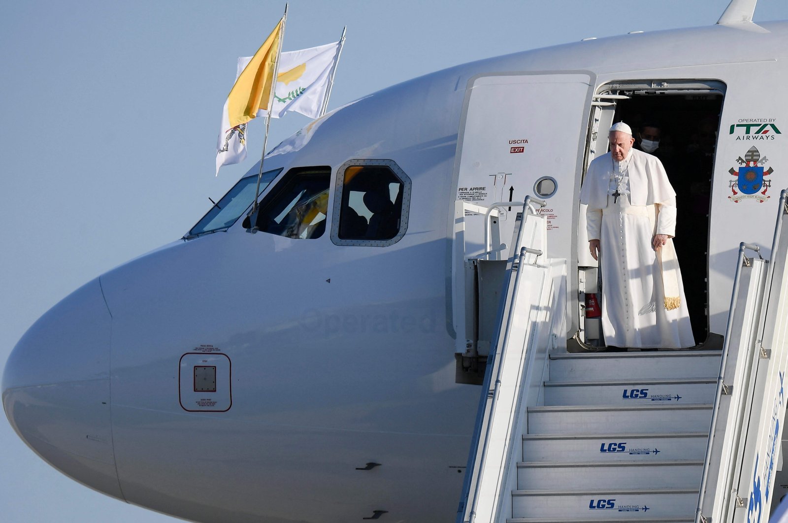 Pope Francis disembarks from the plane upon his arrival in the Greek Cypriot administration controlled city of Larnaca on the island of Cyprus, Dec. 2, 2021 (The Vatican Media handout photo via AFP)