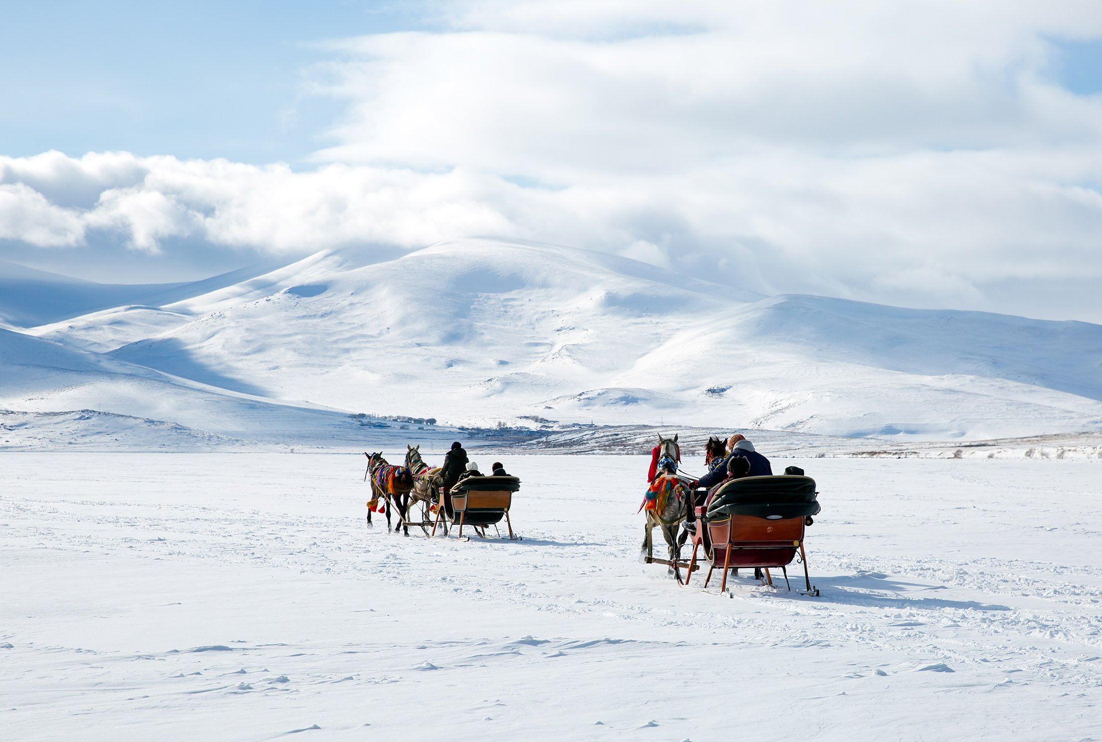 Visitors and locals enjoy sledding, fishing on northeastern Turkey’s frozen Lake Çıldır. (Shutterstock Photo) 
