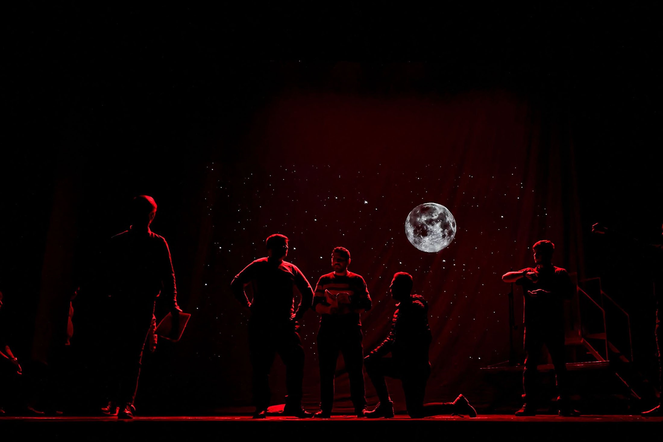 Inmates perform in the final rehearsal of the “State of Siege,” by French author Albert Camus, a play describing a totalitarian Spanish regime during the plague, at the Nottara Theater in Bucharest, Romania, Nov. 24, 2021. (AP Photo)