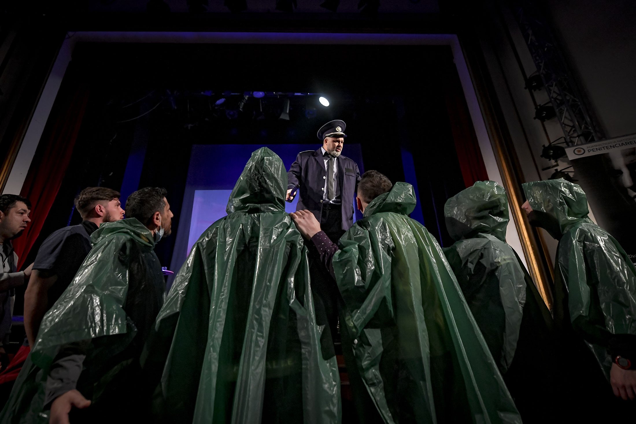 Inmates perform in the “State of Siege,” by French author Albert Camus, a play describing a totalitarian Spanish regime during the plague, at the Nottara Theater in Bucharest, Romania, Nov. 24, 2021. (AP Photo)
