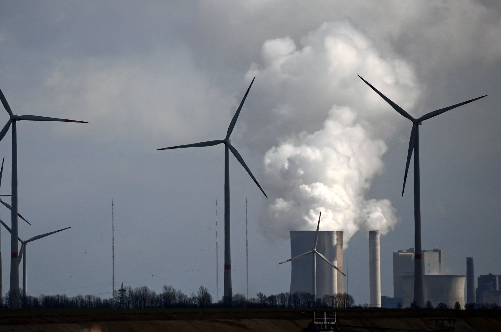 Wind turbines are seen near the coal-fired power station Neurath of German energy giant RWE in Garzweiler, western Germany, March 15, 2021. (AFP Photo)