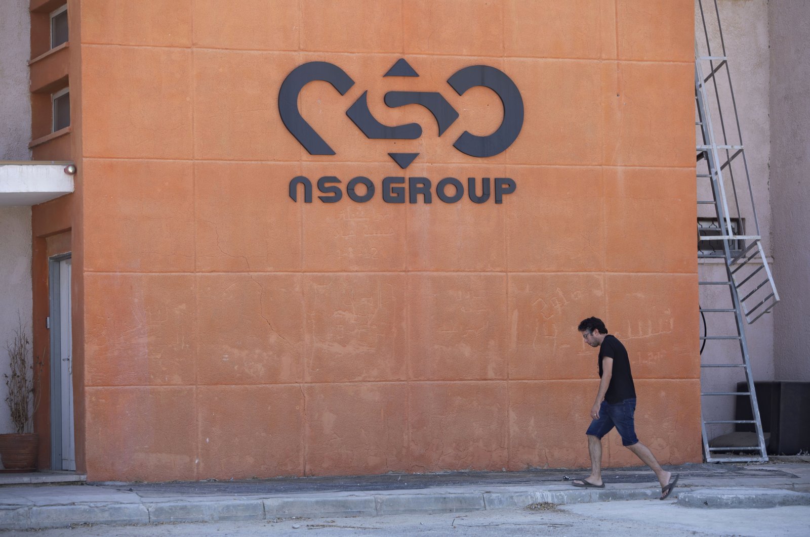 A logo adorns a wall on a branch of the Israeli NSO Group company, near the southern town of Sapir, Israel, Aug. 24, 2021. (AP Photo)