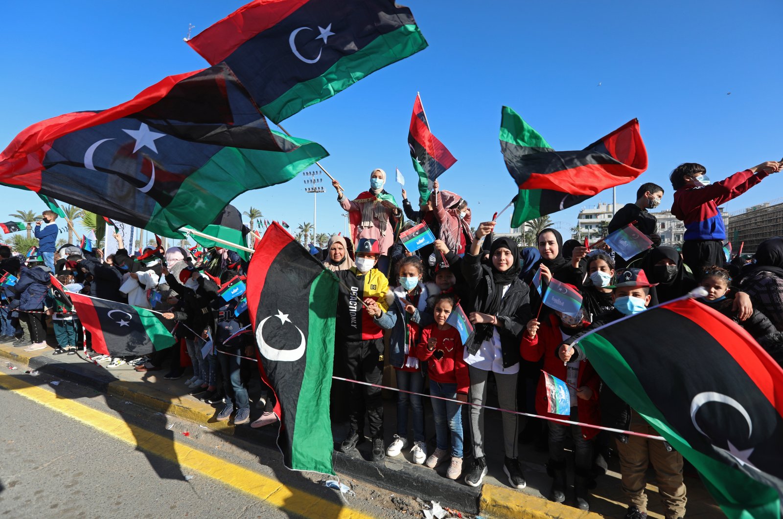 Under tight security, Libyans mark the 10th anniversary of their 2011 uprising that led to the overthrow and killing of longtime ruler Moammar Gadhafi in Martyrs Square, Tripoli, Libya. (AP File Photo)