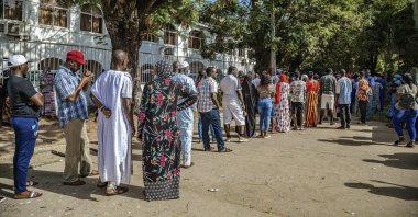 Gambians line up to cast their ballots in the presidential elections in Banjul, Gambia, Dec. 4, 2021. (Photo by EPA) 