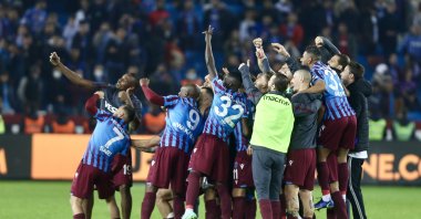 Trabzonspor players celebrate after winning a Turkish Süper Lig match against Adana Demirspor, at the Medical Park Stadium, in Trabzon, Turkey, Dec. 4, 2021. (AA Photo)