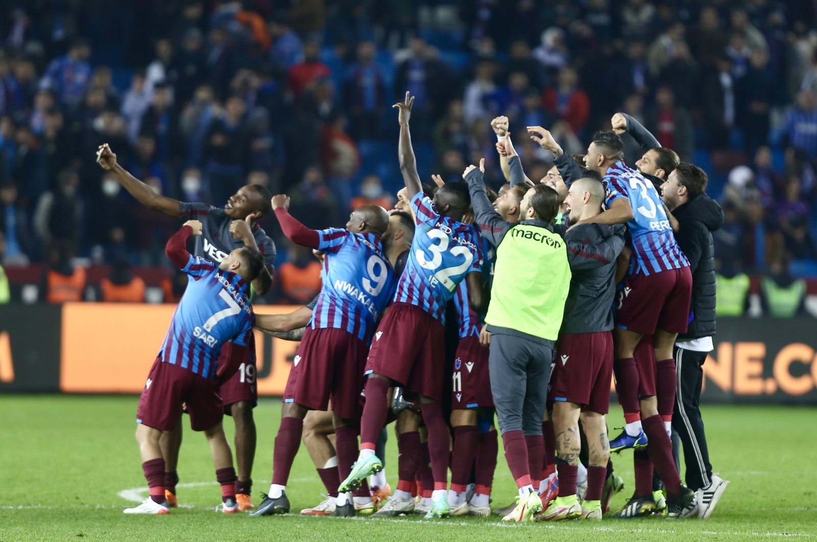 Trabzonspor players celebrate after winning a Turkish Süper Lig match against Adana Demirspor, at the Medical Park Stadium, in Trabzon, Turkey, Dec. 4, 2021. (AA Photo)