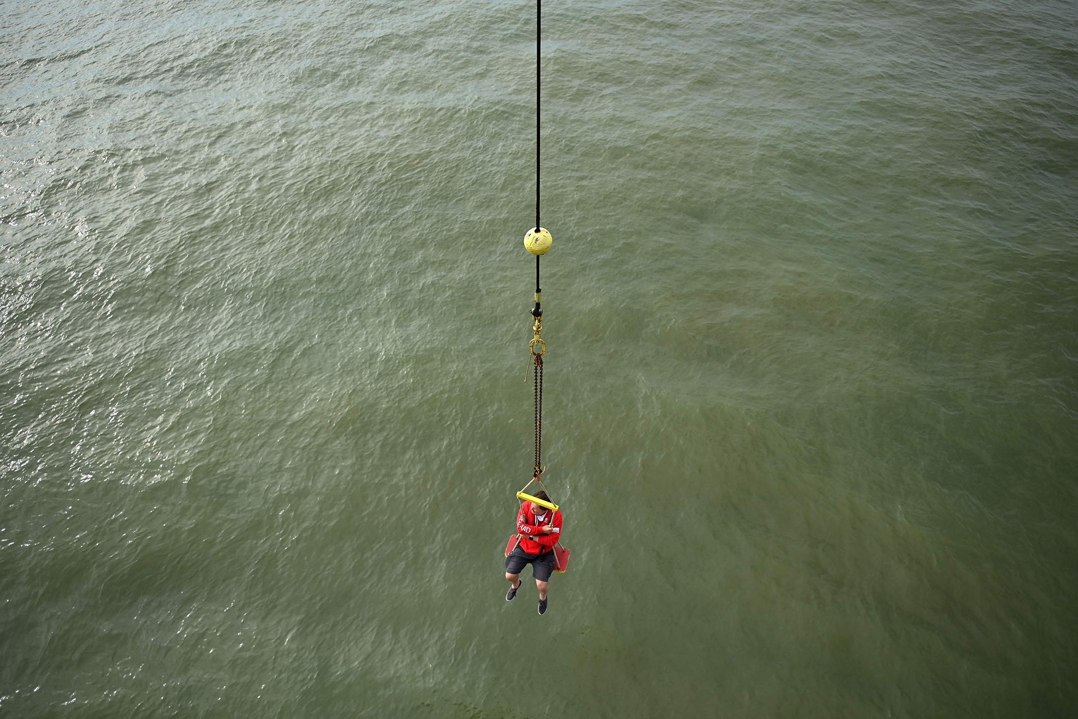 A visitor is winched onto the Principality of Sealand, some 11 kilometers (7 miles) off the coast of southeast England, U.K., Sept. 16, 2021. (AFP Photo)