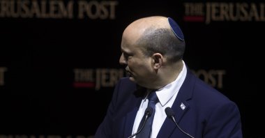 Israeli Prime Minister Naftali Bennett leaves after speaking at the Jerusalem Post's annual conference, in West Jerusalem, Israel, Oct. 12, 2021. (Photo by Getty Images)