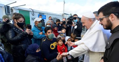 Pope Francis (2nd R) meets refugees at the Reception and Identification Center in Mytilene on the island of Lesbos, Dec. 5, 2021. (VATICAN MEDIA / AFP) /