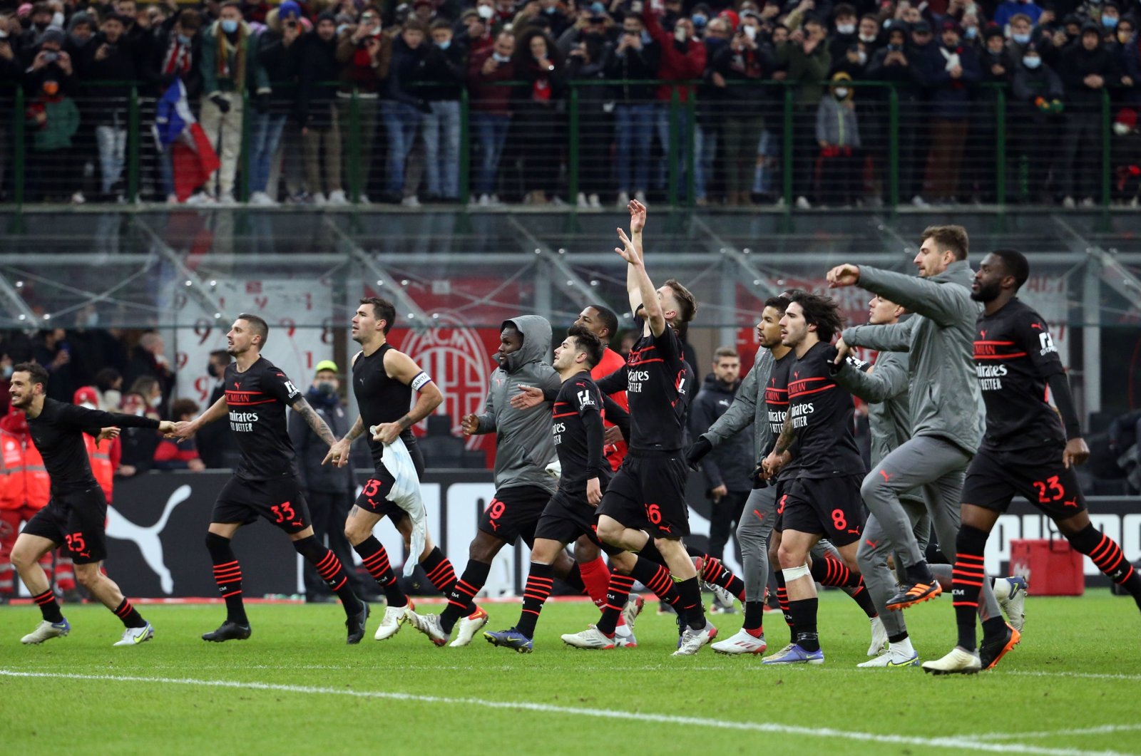 AC Milan players celebrate their win in a Serie A match against Salernitana, Milan, Italy, Dec. 4, 2021. (EPA Photo)