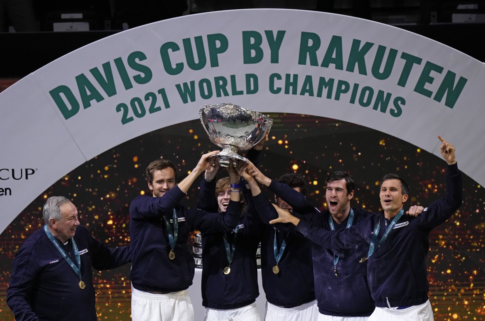 The Russian Tennis Federation team celebrate with the trophy after winning the Davis Cup tennis final at the Madrid Arena in Madrid, Spain, Dec. 5, 2021. (AP Photo)