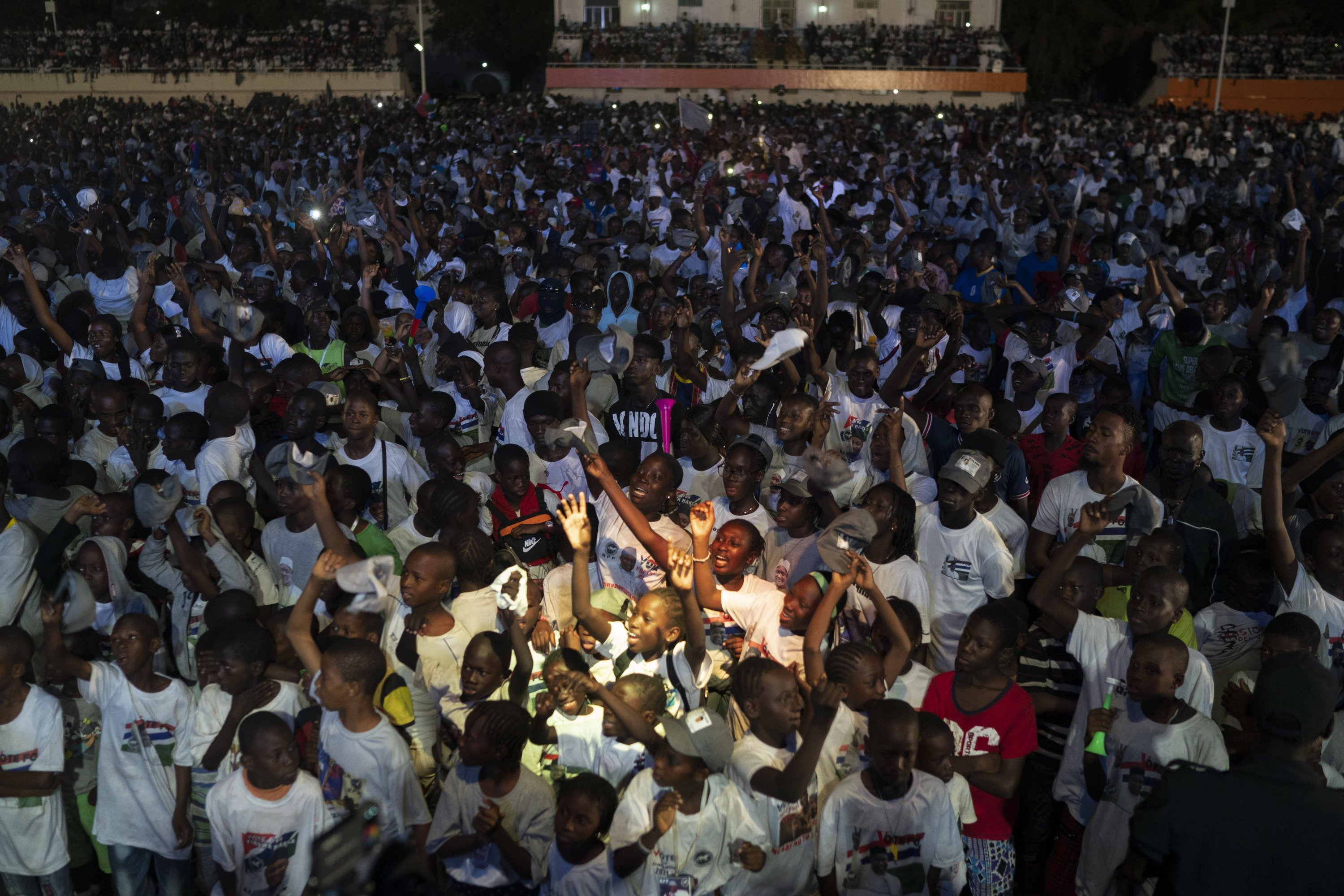 Supporters of Gambian President Adama Barrow celebrate the victory of their candidate in the presidential election in Banjul, Gambia, Dec. 5, 2021. (AP Photo)