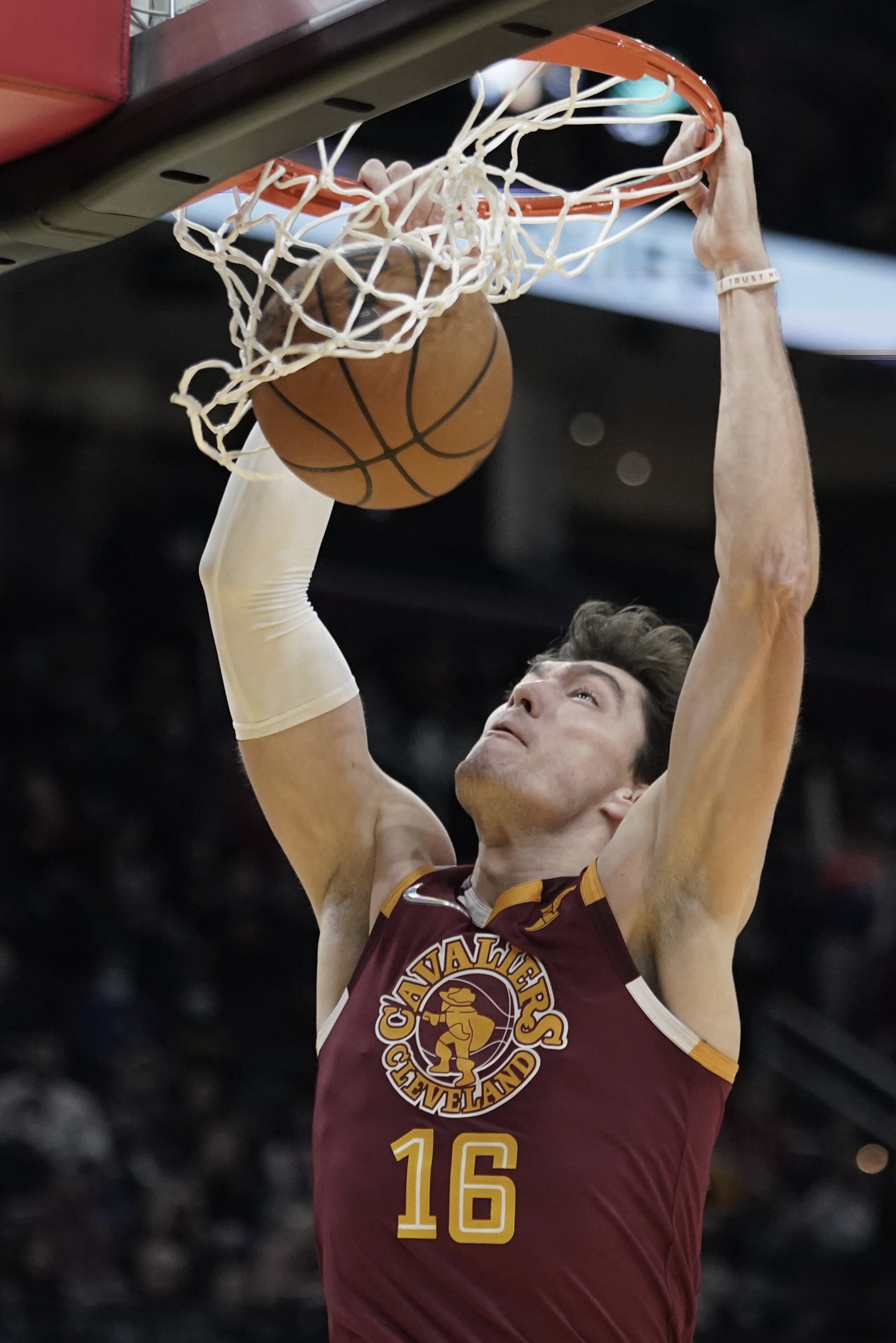 Cleveland Cavaliers' Cedi Osman dunks against the Utah Jazz in the second half of an NBA basketball game, Sunday, Dec. 5, 2021, in Cleveland. (AP Photo/Tony Dejak)