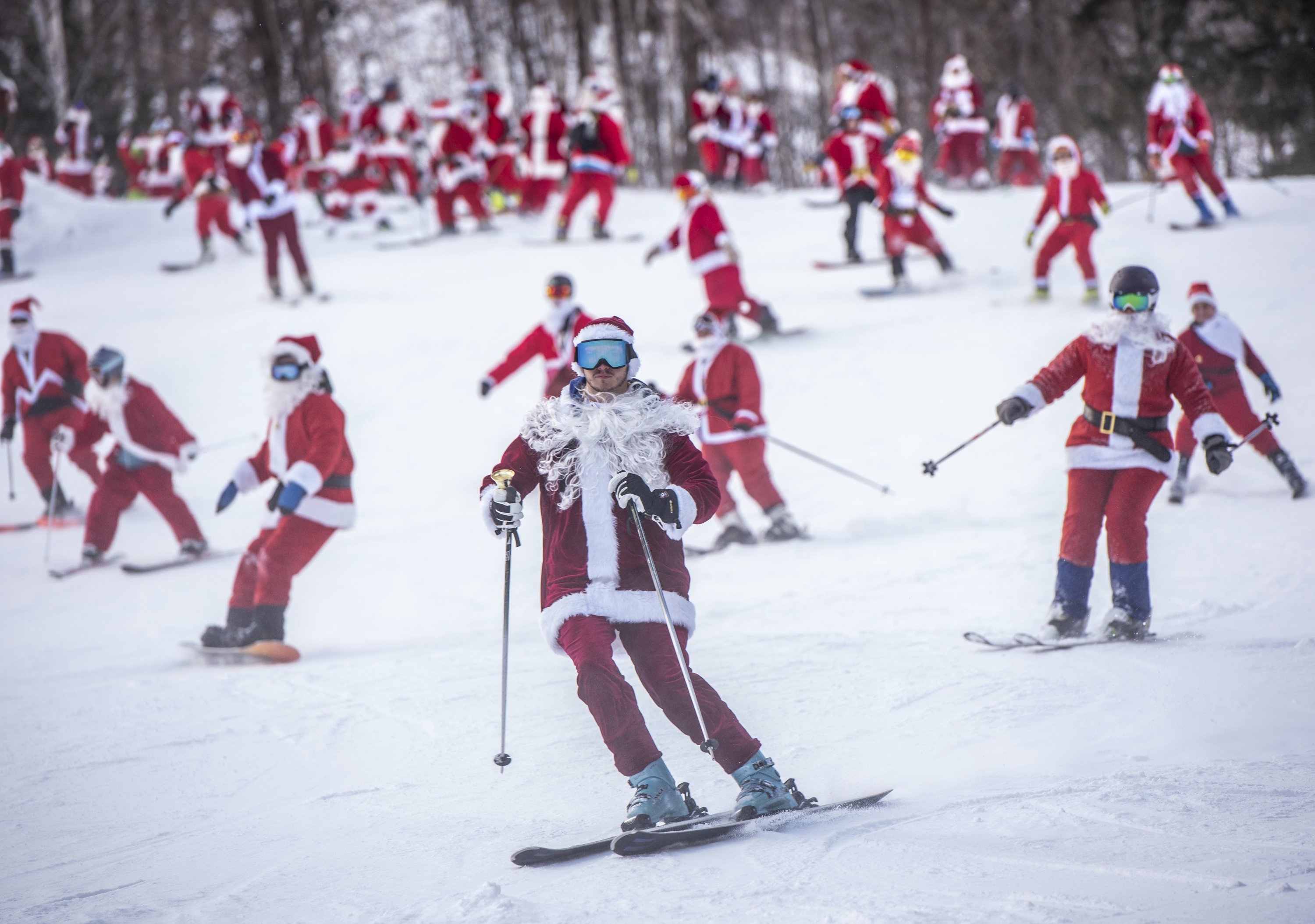 Skiers and snowboarders hit the slopes Sunday at Sunday River Ski Resort in Newry, Maine, U.S., Dec. 5, 2021. (Andree Kehn/Sun Journal via AP)