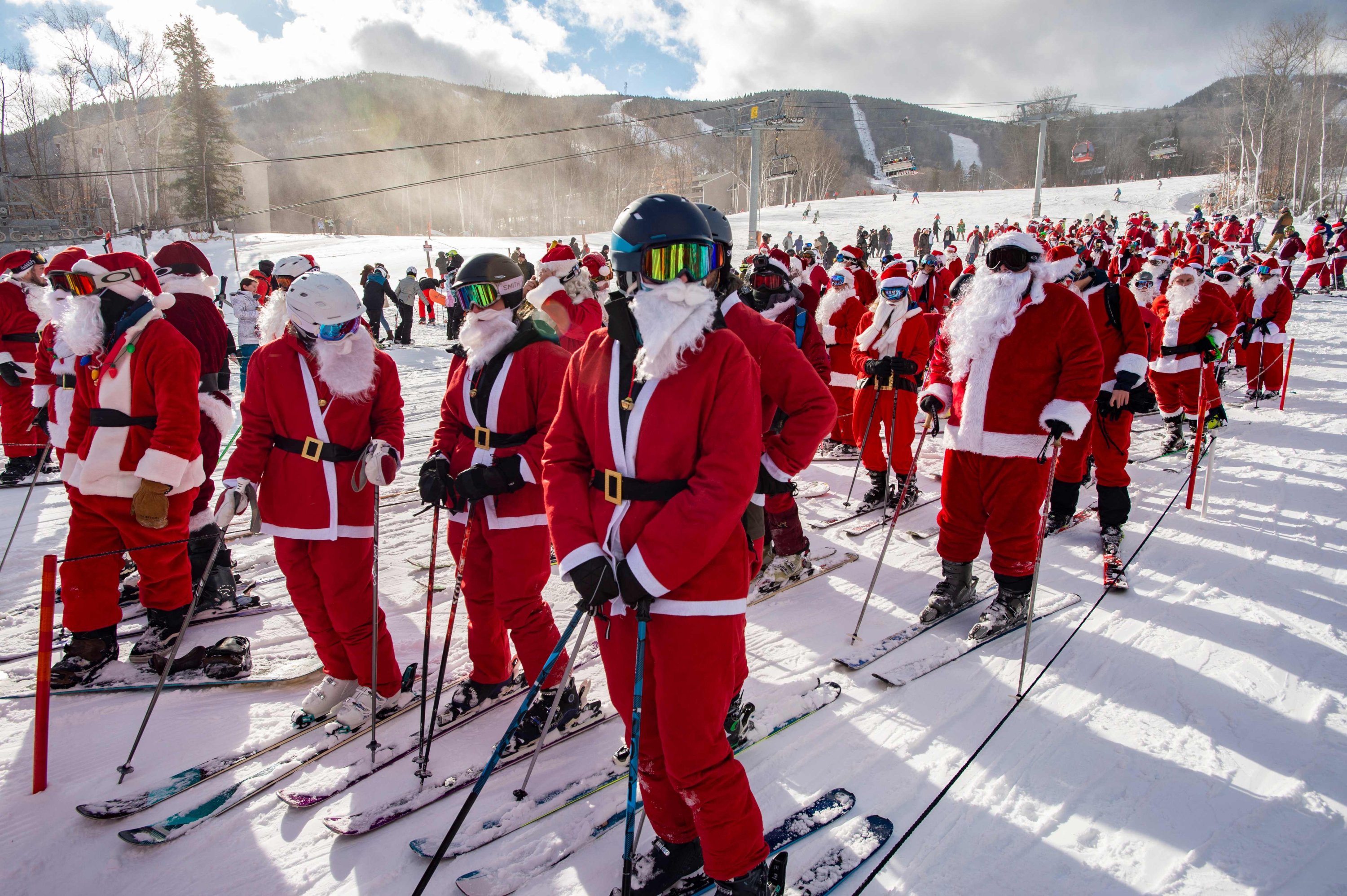 Skiers and snowboarders take part in the annual Santa Ski Run on Santa Sunday at Sunday River in Newry, Maine, U.S., Dec. 5, 2021. (AFP Photo)