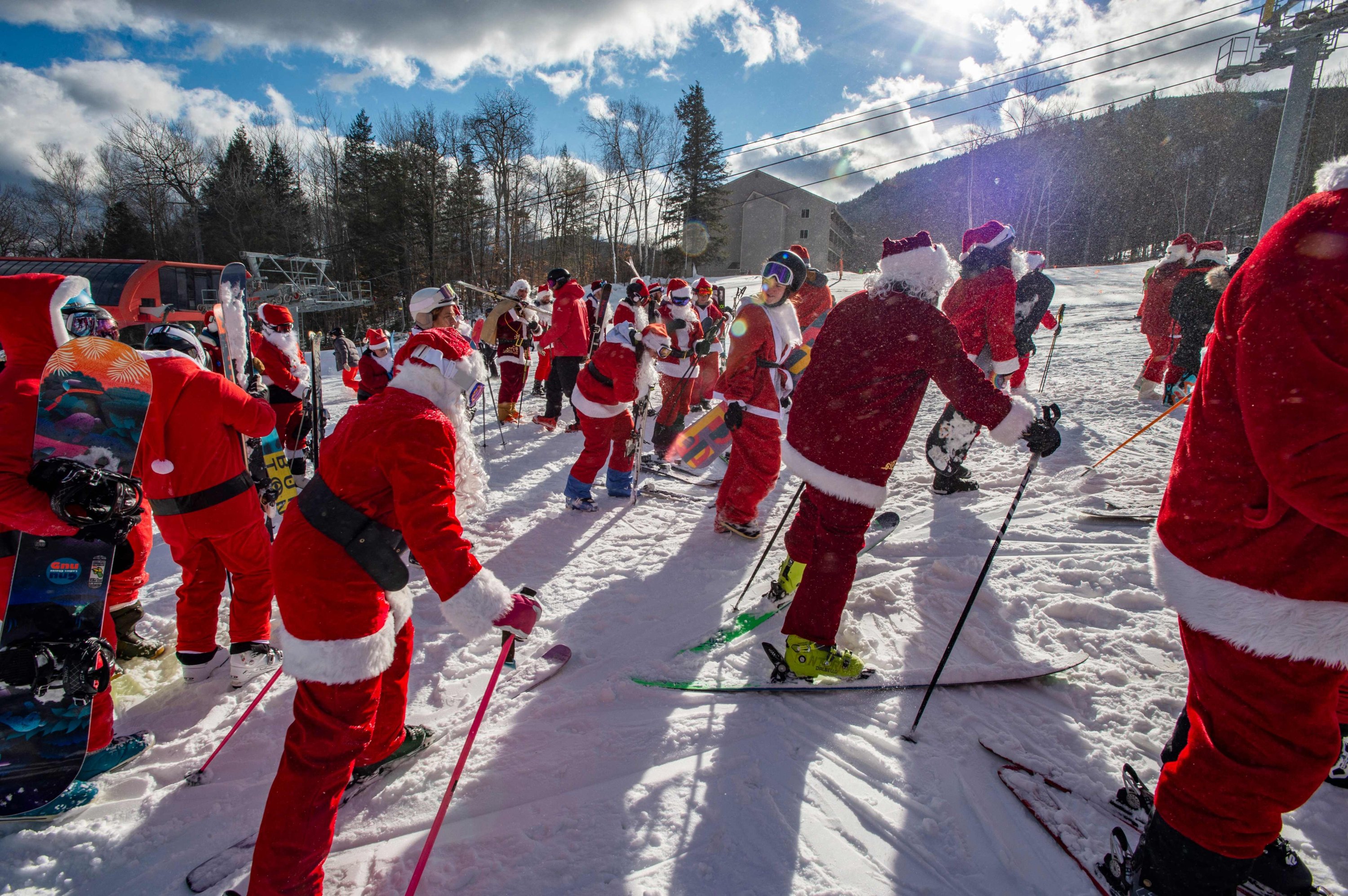 Skiers and snowboarders take part in the annual Santa Ski Run on Santa Sunday at Sunday River in Newry, Maine, U.S., Dec. 5, 2021. (AFP Photo)