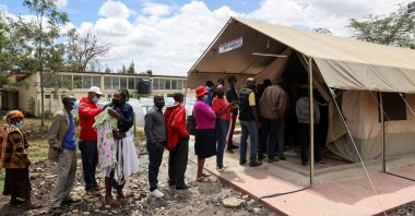 People stand in line to receive a COVID-19 vaccine, at the Narok County Referral Hospital, in Narok, Kenya, Dec. 1, 2021. (Reuters Photo)