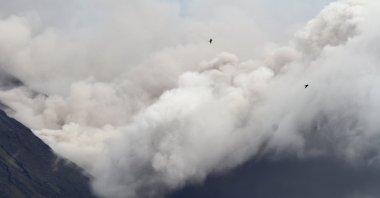 Mount Semeru volcano spews ashes and clouds as seen from Lumajang, Indonesia, Dec. 6, 2021. (Antara Foto via Reuters)