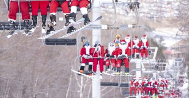 Skiers and snowboarders hit the slopes at Sunday River Ski Resort in Newry, Maine, U.S., Dec. 5, 2021. (Andree Kehn/Sun Journal via AP)