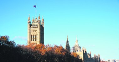 The British flag flies above Victoria Tower and the Palace of Westminster in London, U.K., Nov. 22, 2021. (Photo by Getty Images)