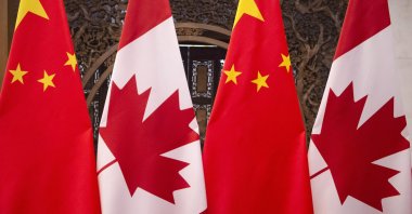 Flags of Canada and China prior to a meeting of Canadian Prime Minister Justin Trudeau and Chinese President Xi Jinping at the Diaoyutai State Guesthouse in Beijing, Dec. 5, 2017. (AP File Photo)