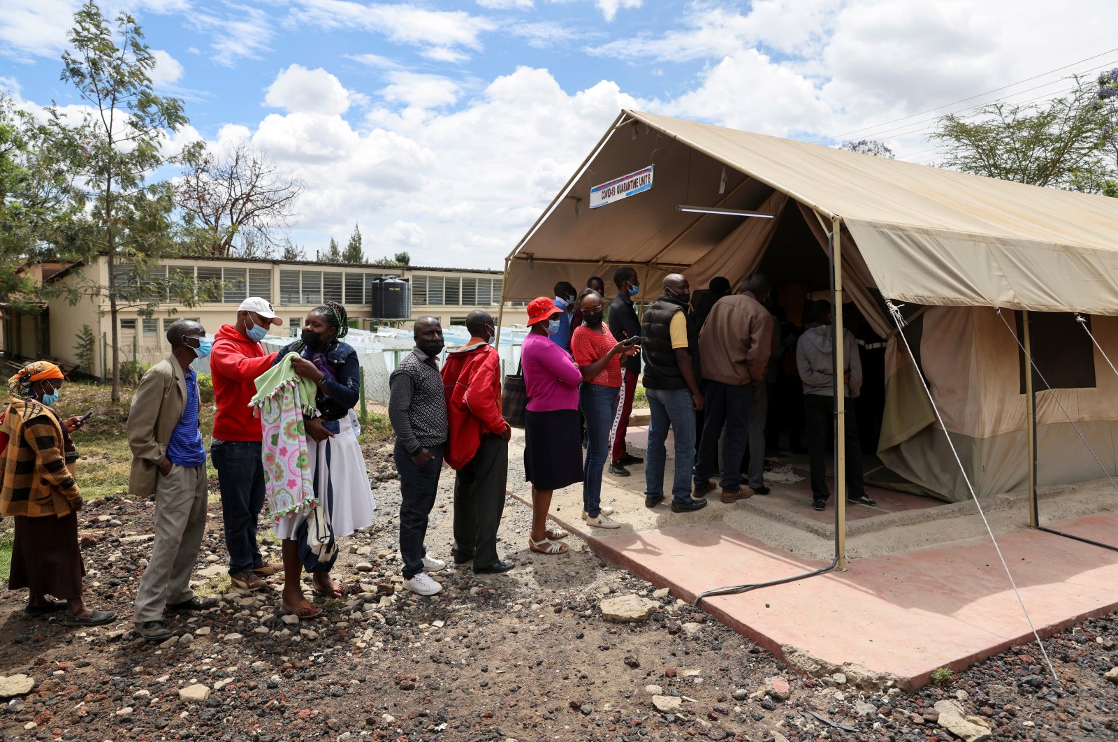 People stand in line to receive a COVID-19 vaccine, at the Narok County Referral Hospital, in Narok, Kenya, Dec. 1, 2021. (Reuters Photo)
