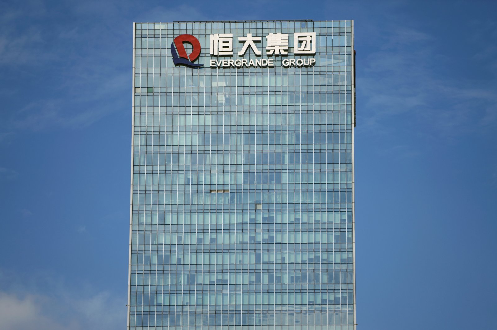 The logo of China Evergrande Group is seen on the property developer&#039;s headquarters in Shenzhen, Guangdong province, China, Sept. 26, 2021. (Reuters Photo)