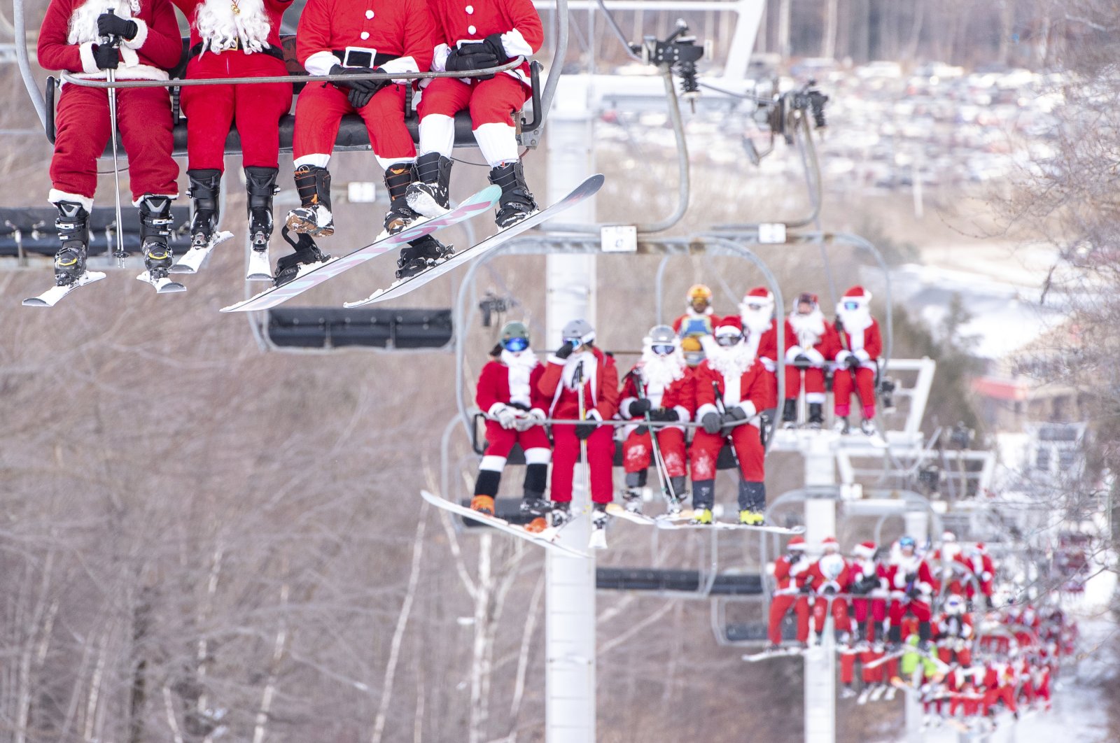 Skiers and snowboarders hit the slopes at Sunday River Ski Resort in Newry, Maine, U.S., Dec. 5, 2021. (Andree Kehn/Sun Journal via AP)