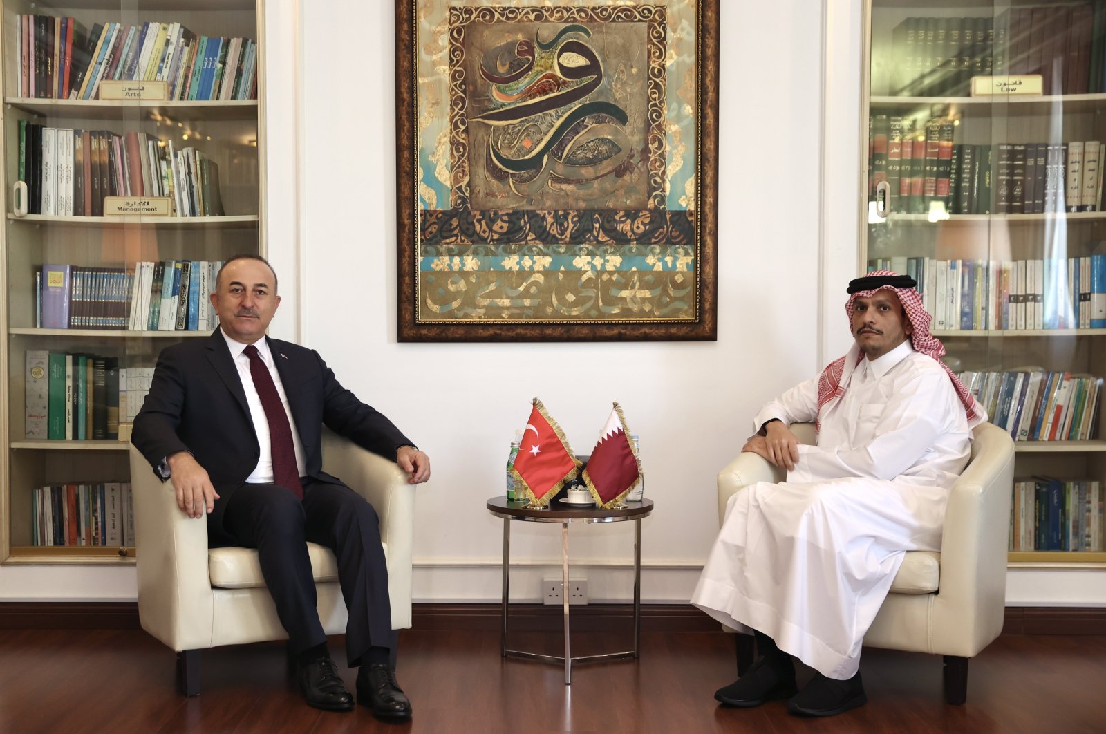 Foreign Minister Mevlüt Çavuşoğlu (L) and his Qatari counterpart Sheikh Mohammed bin Abdulrahman Al Thani in Doha, Qatar, Dec. 6, 2021. (AA Photo)