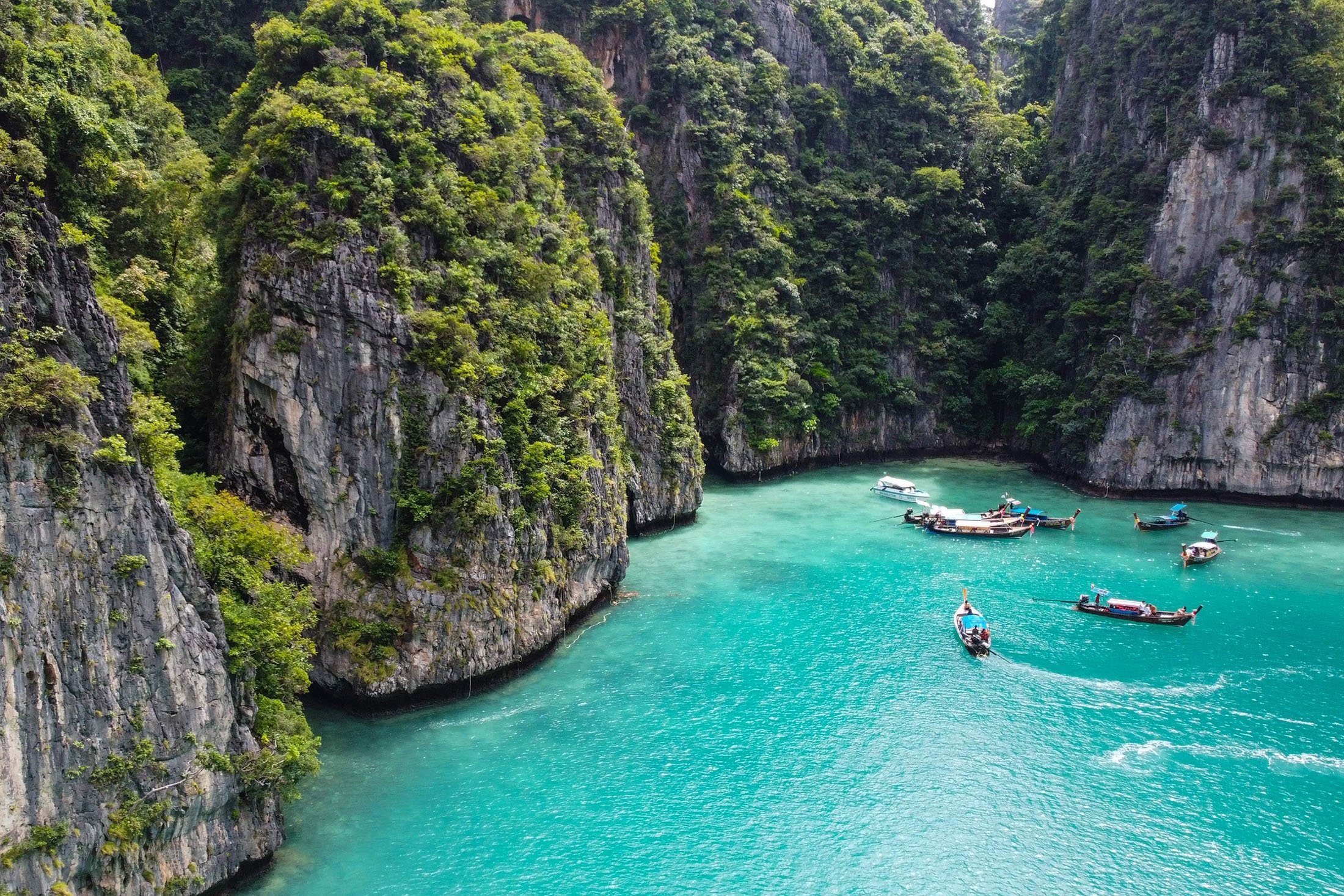 Tourists enter Pi Leh Bay in longtail boats on the Phi Phi Leh island, Thailand, Nov. 26, 2021. (AFP Photo)