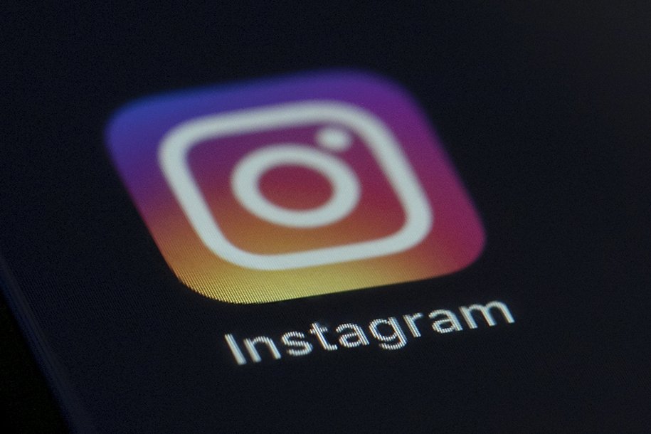 The Instagram app icon is displayed on the screen of a mobile device in New York, U.S., Aug. 23, 2019. (AP Photo)