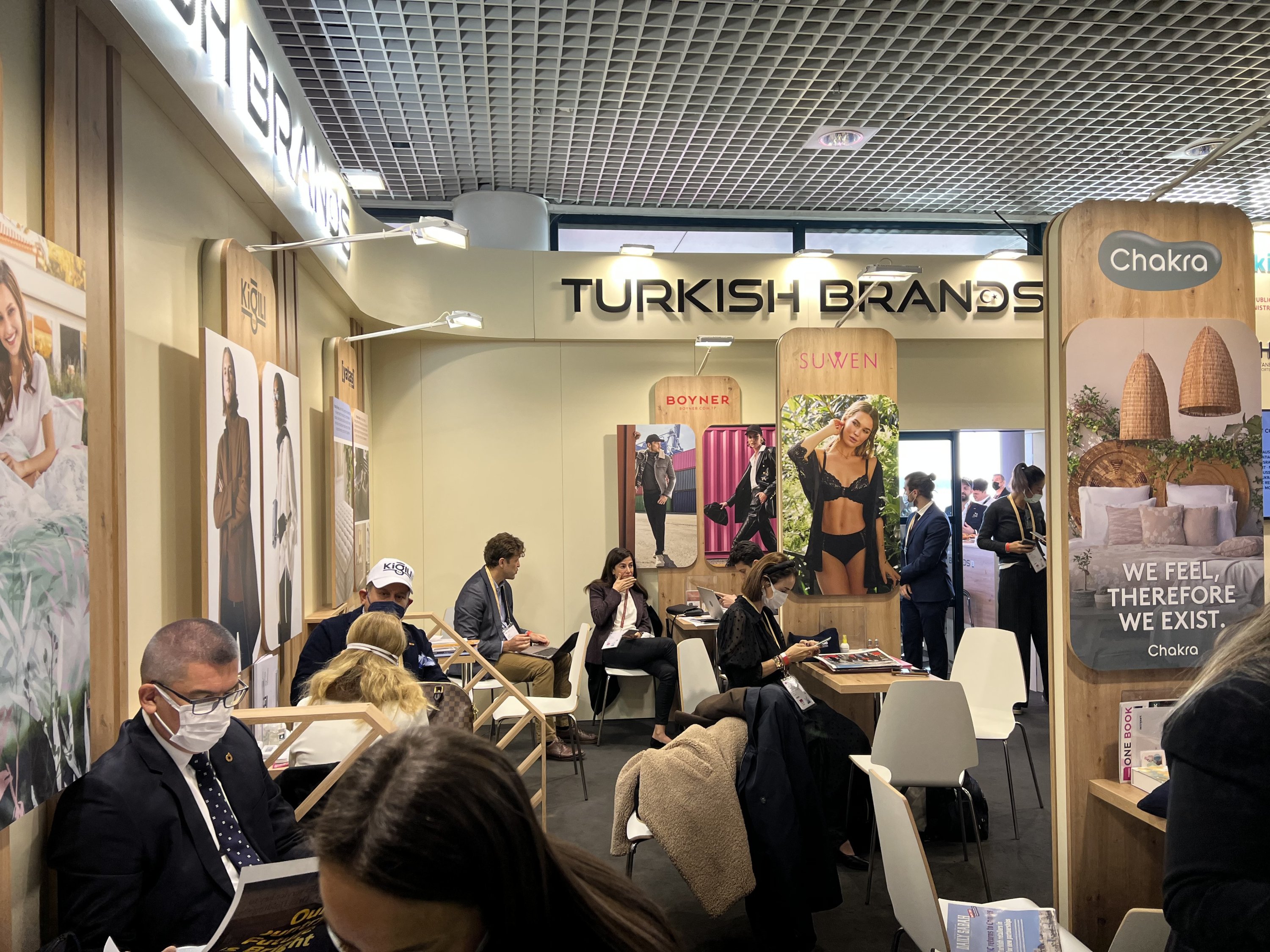 Visitors and representatives of Turkish retail companies are seen at the Turkish Brands booth during the MAPIC fair, Cannes, France, Nov. 30, 2021.