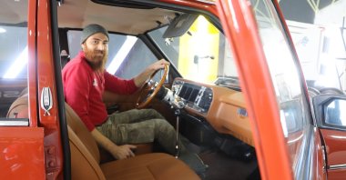 Semih Çakmak, 30, inside one of his classic car rebuilds Samsun, Turkey, Dec. 6, 2021. (IHA Photo)
