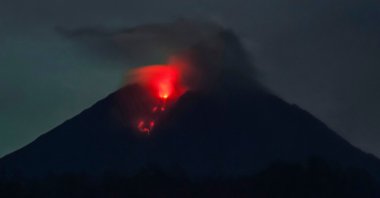 Mount Semeru spews lava, as seen from Sumber Wuluh village in Lumajang, Indonesia, Dec. 6, 2021. (AFP Photo)