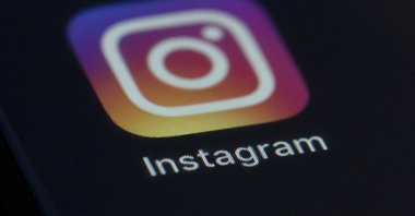 The Instagram app icon is displayed on the screen of a mobile device in New York, U.S., Aug. 23, 2019. (AP Photo)