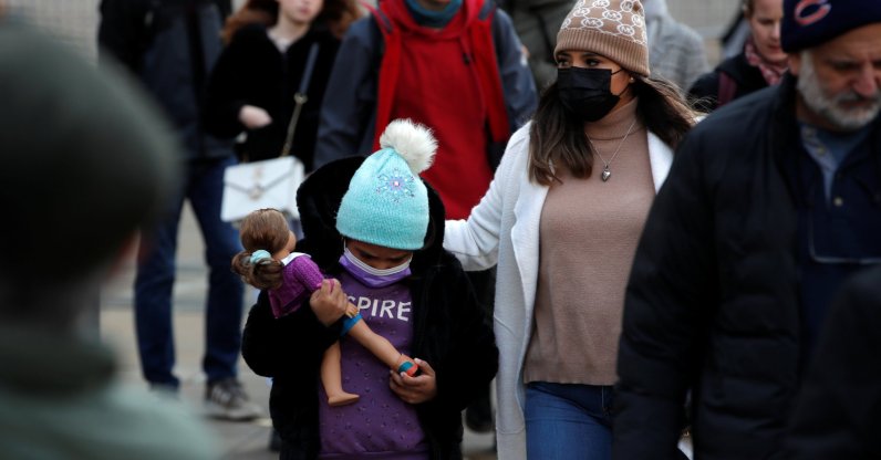 A mother and child wear protective face masks in lower Manhattan after New York City Mayor Bill de Blasio announced that all private-sector employers must implement COVID-19 vaccine mandates for their workers, as the highly transmissible omicron variant has spread to at least one-third of U.S. states, in New York, U.S., Dec. 6, 2021. (Reuters Photo)
