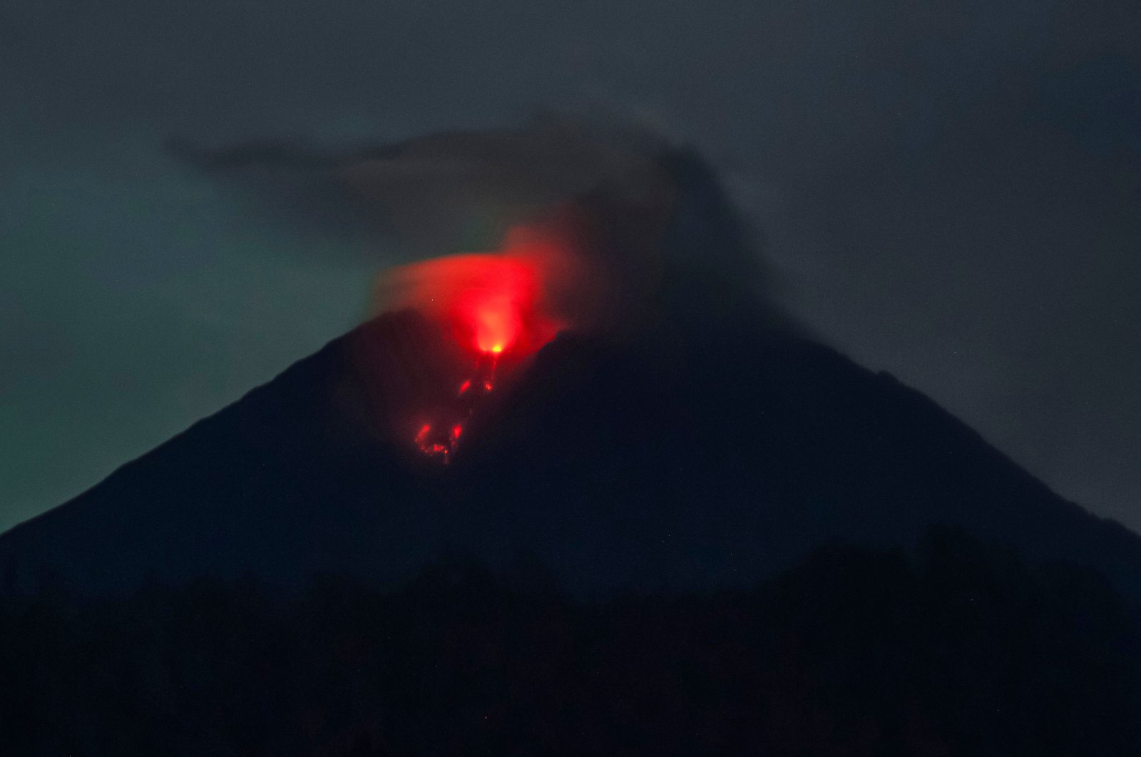 Mount Semeru spews lava, as seen from Sumber Wuluh village in Lumajang, Indonesia, Dec. 6, 2021. (AFP Photo)