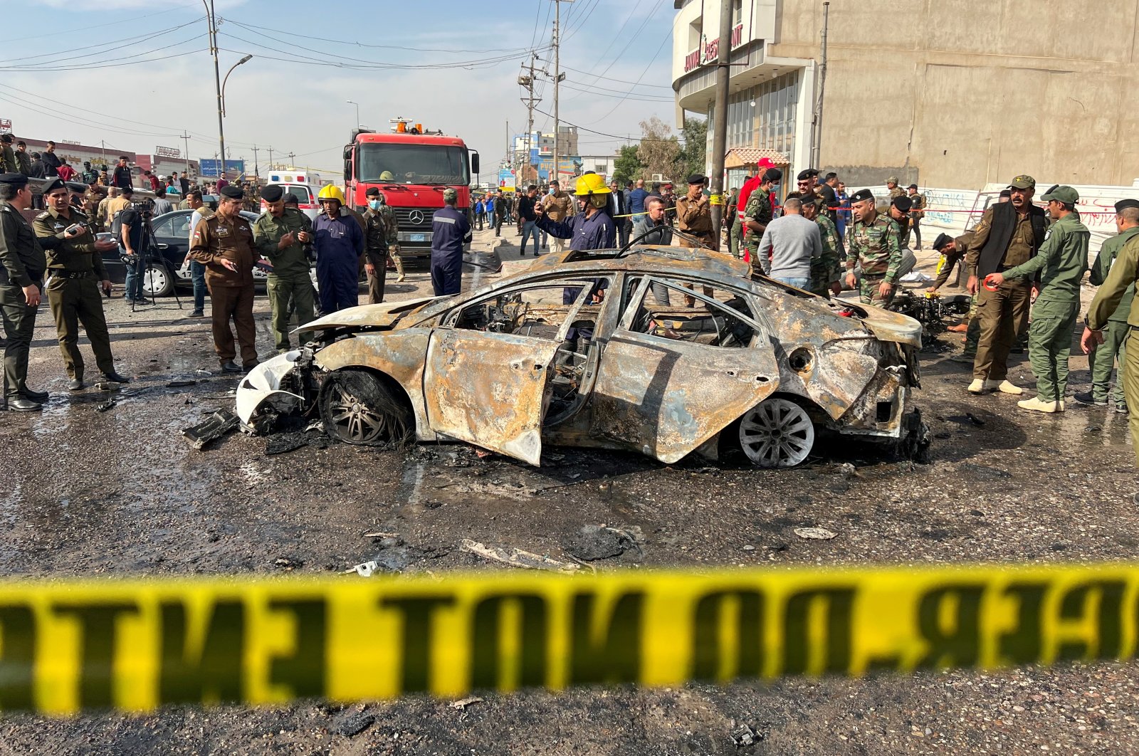 Iraqi security forces inspect the site of an explosion in Basra, Iraq, Dec. 7, 2021. (Reuters Photo)