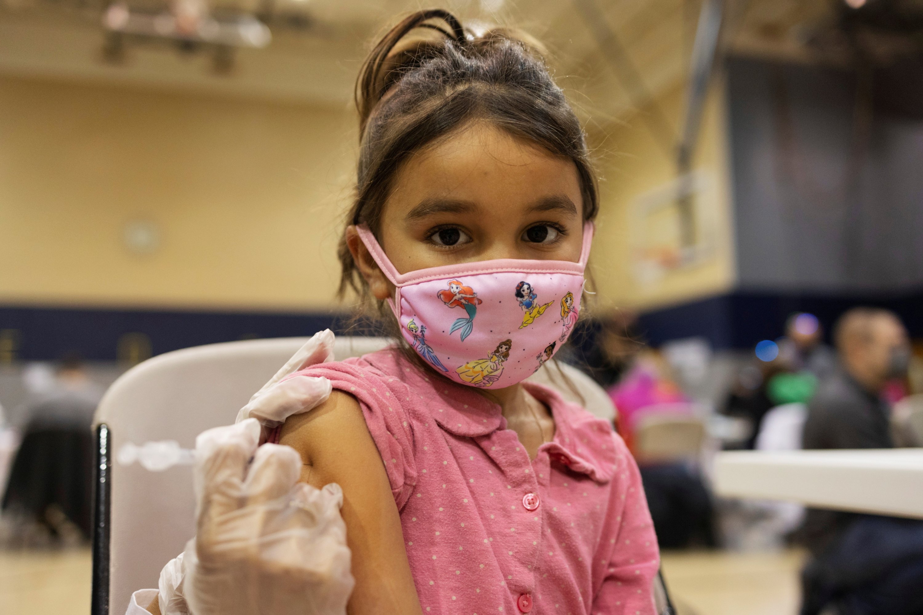 A girl receives the Pfizer-BioNTech coronavirus disease (COVID-19) vaccine in Lansdale, Pennsylvania, U.S., Dec. 5, 2021. (Reuters Photo) 