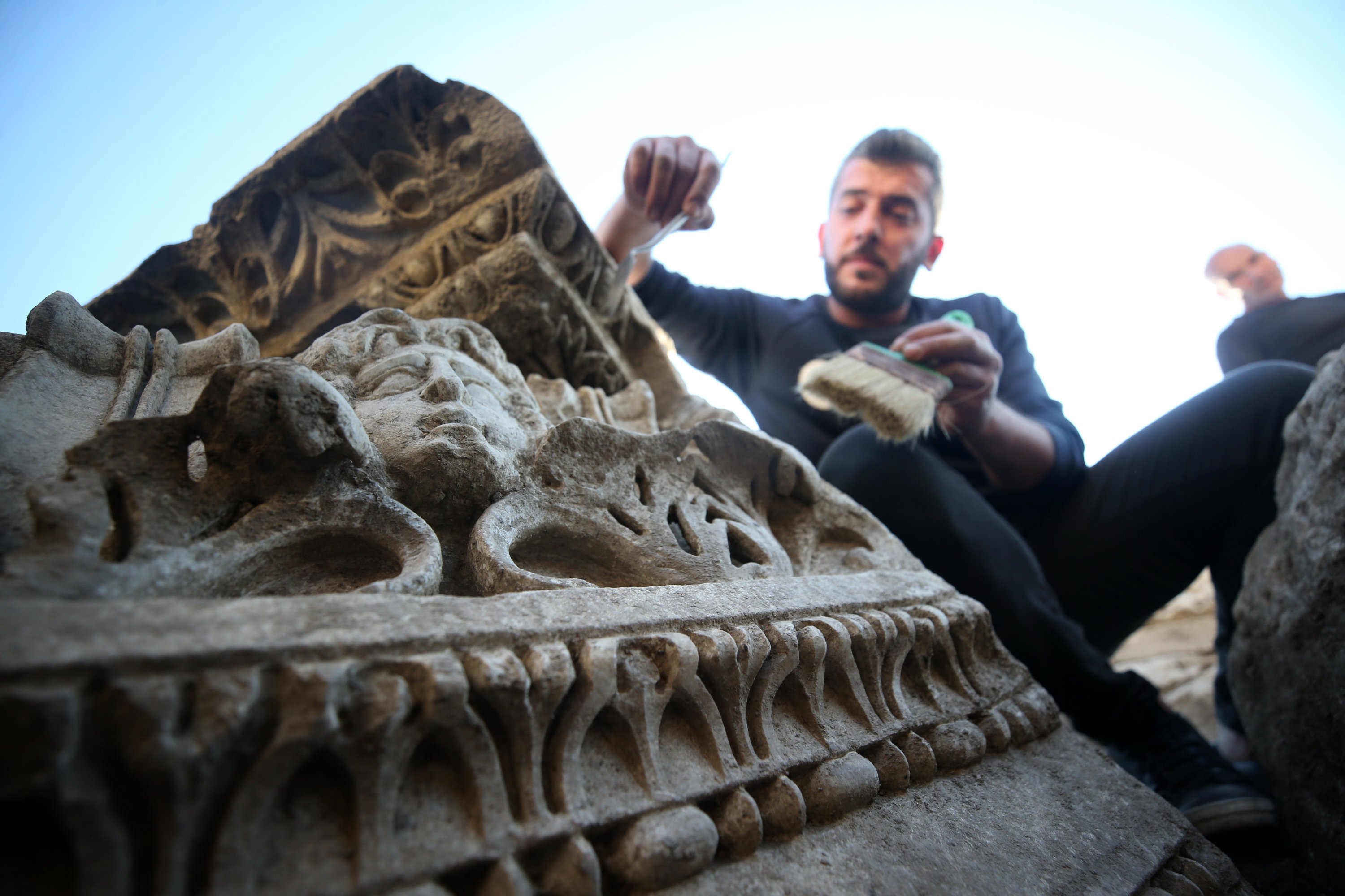 An archaeologist works on a sculpture found in Prusias ad Hypium, Düzce, northwestern Turkey, Dec. 8, 2021. (AA)