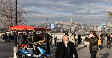 People wearing protective masks against COVID-19 walk in Eminönü, in Istanbul, Turkey, Dec. 6, 2021. (Reuters Photo)