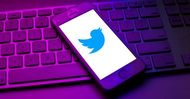 A Twitter logo is displayed on a smartphone on top of a computer keyboard, Spain, Oct. 13, 2021. (Photo by Getty Images)