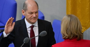 German Chancellor Olaf Scholz (L) takes the oath from President of the Bundestag (lower house of parliament) Baerbel Bas (R) during a session at the Bundestag, Berlin, Germany, Dec. 8, 2021. (AFP Photo)