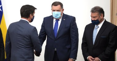 U.S. Ambassador to Bosnia-Herzegovina Eric Nelson (L), Bosnian Serb member of the tripartite Presidency of Bosnia Milorad Dodik (C) and U.S. Deputy Assistant Secretary of State Gabriel Escobar (R) during their meeting in Sarajevo, Bosnia-Herzegovina, Dec. 8, 2021. (EPA Photo)