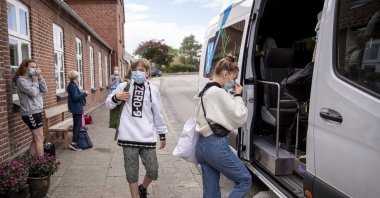 Students board the school bus at a schol in Samso, Denmark, Sept. 7, 2020. (Getty Images)